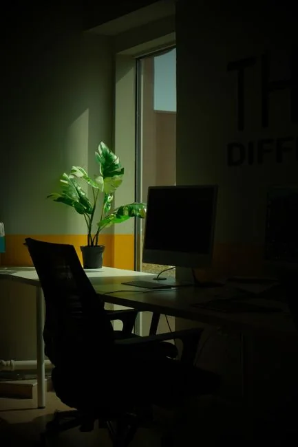 A polished office desk arrangement showcasing Apple devices: iMac, MacBook, and iPad.
